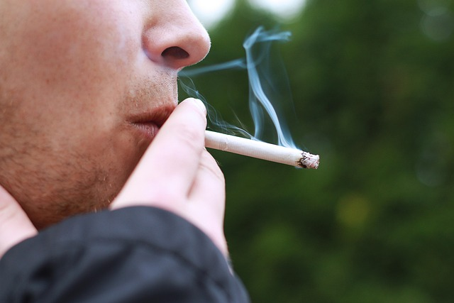 Man smoking a cigarette outdoors
